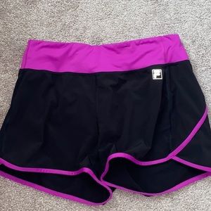 purple and black FILA shorts